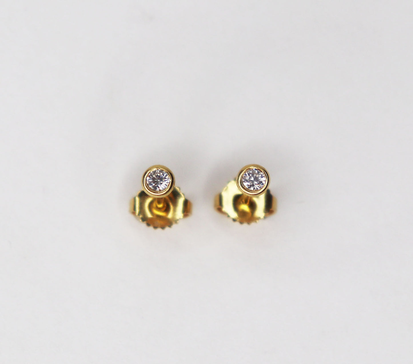 18kt Tiffany & Co. Bezel Set .20ctw Diamond Studs